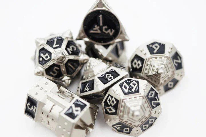 The Dice 51: Onyx Ethers RPG Metal Dice Set with UFO theme, black faces, and white numbers.