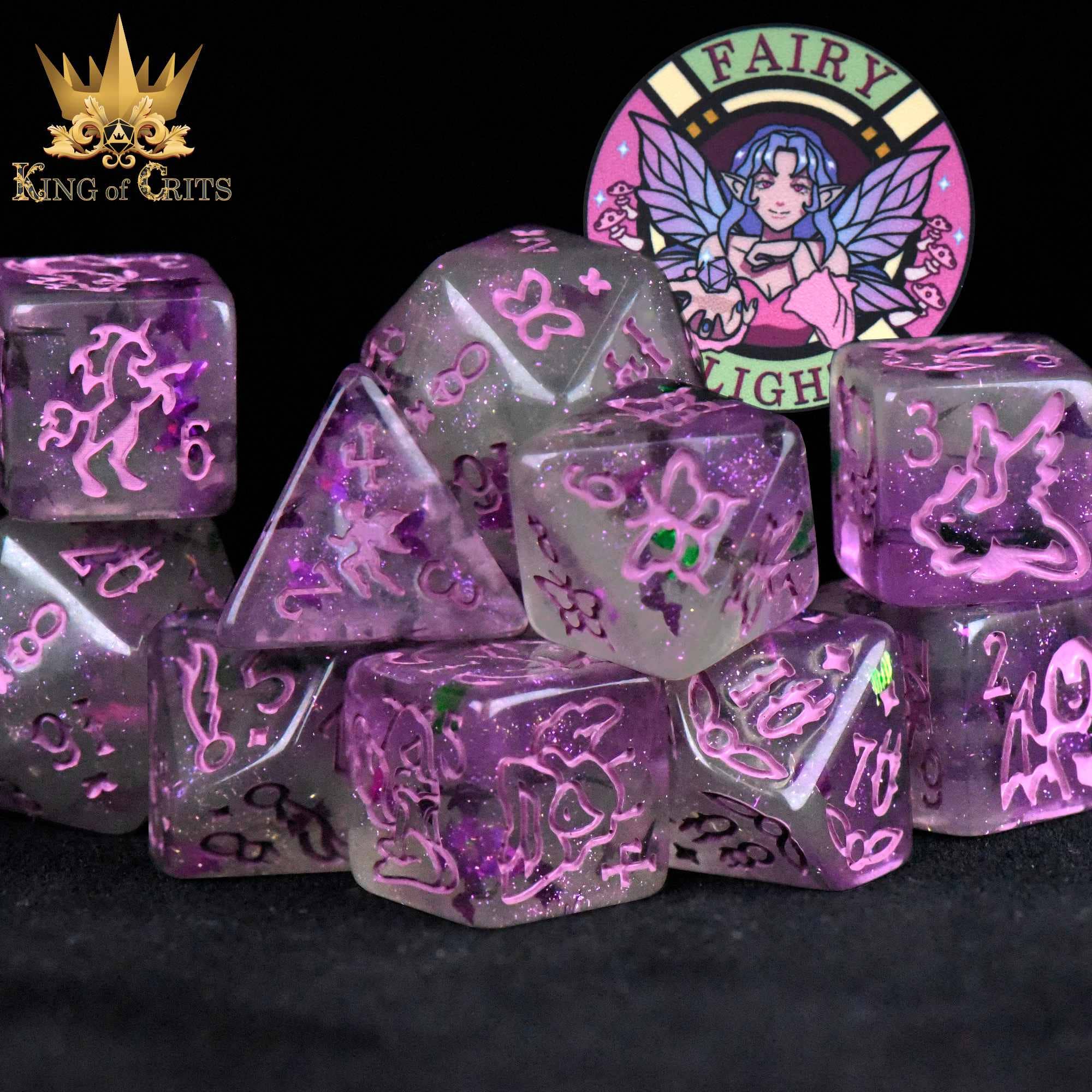 The Fairy Flight 11 Dice Set with purple glitter dice, fairy designs, Fairy Light badge, and King of Crits logo.