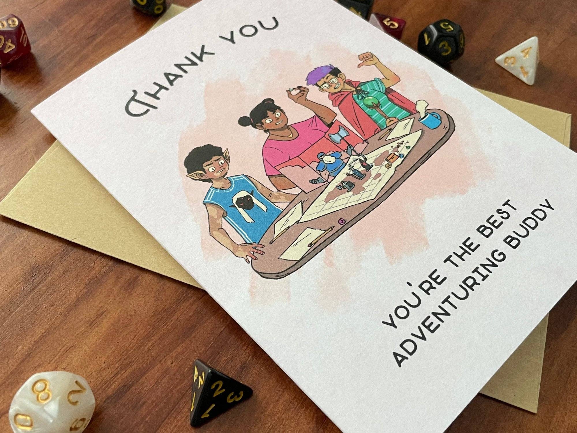 Handmade greeting card with cartoon characters gaming and the text “YOU’RE THE BEST ADVENTURING BUDDY.”.