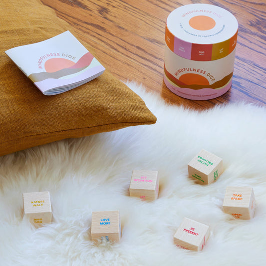 Mindfulness Dice with meditation exercises including “be present” and “love more.”.