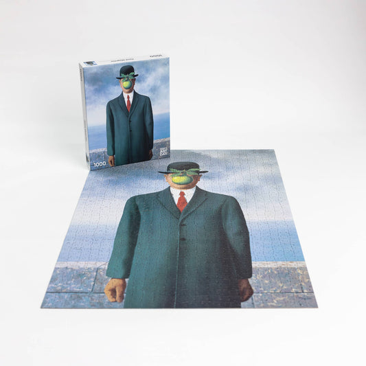 The Puzzle - René Magritte - Son of Man; suited man in a bowler hat with green apple covering his face.