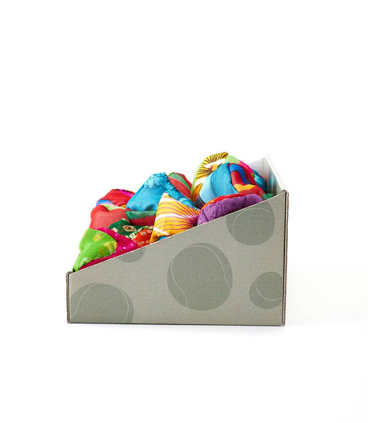 Sari Footbag Hacky Sack in gray box with circular patterns, side view.