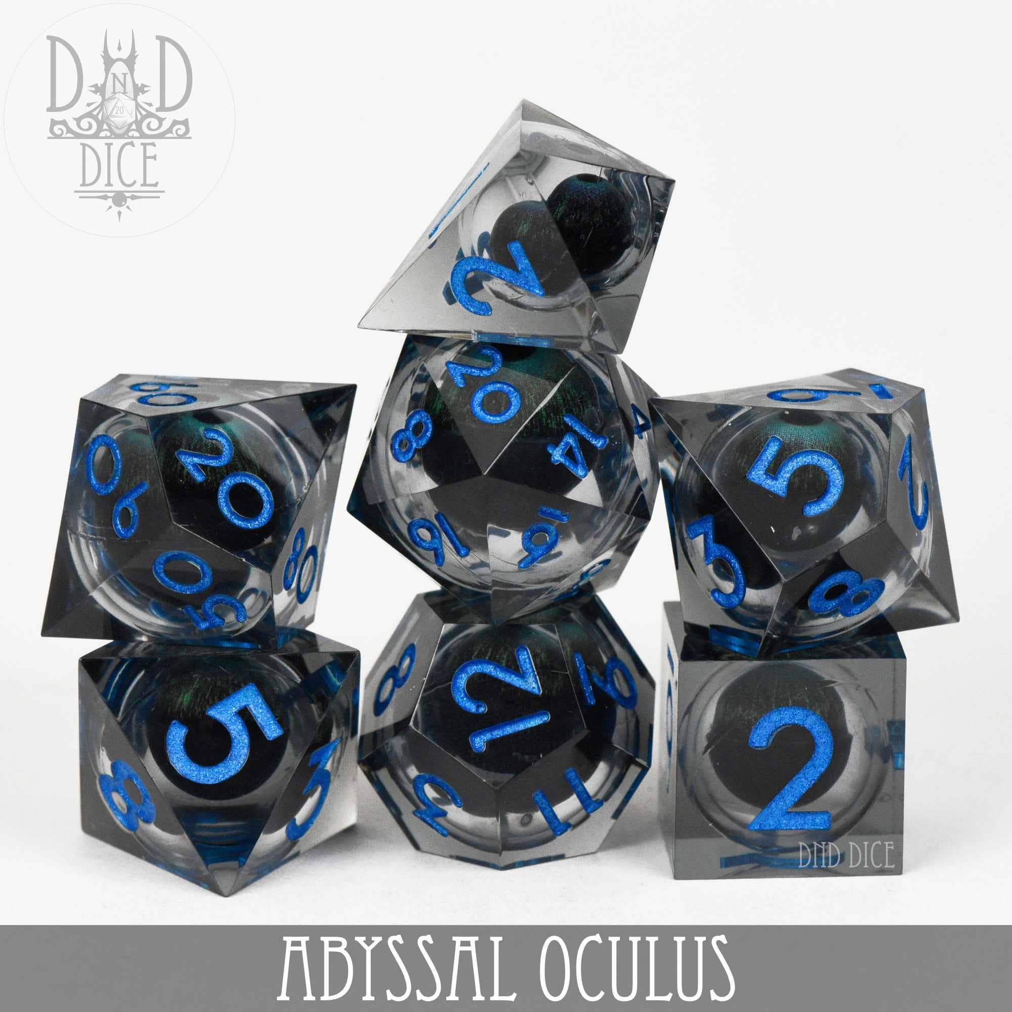 Abyssal Oculus liquid core polyhedral dice with clear resin, dark centers, and blue numbering.