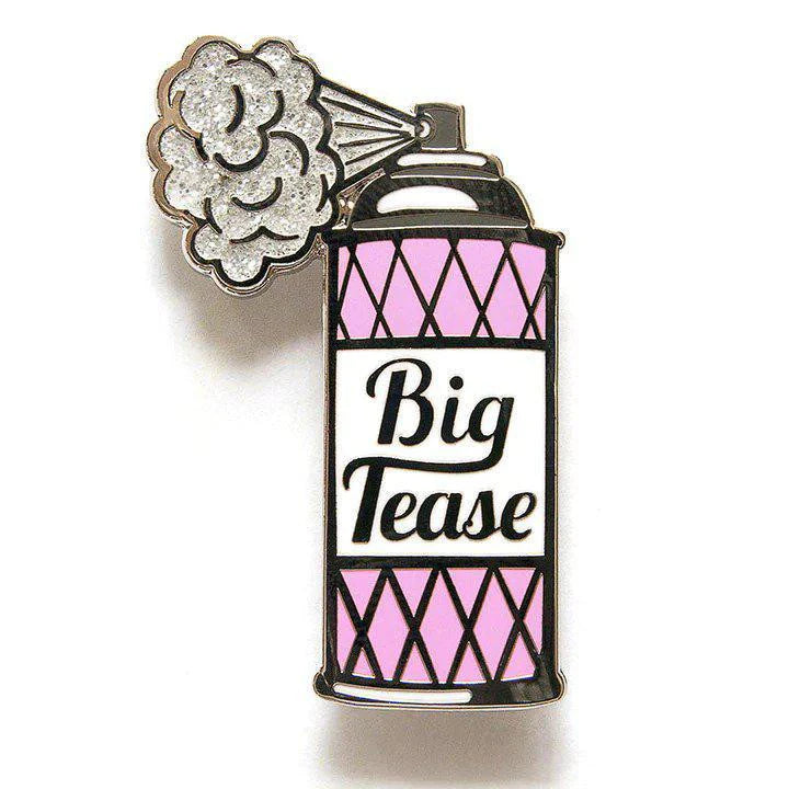 Big Tease glitter spray pin in the shape of a pink can, with a mist cloud detail.