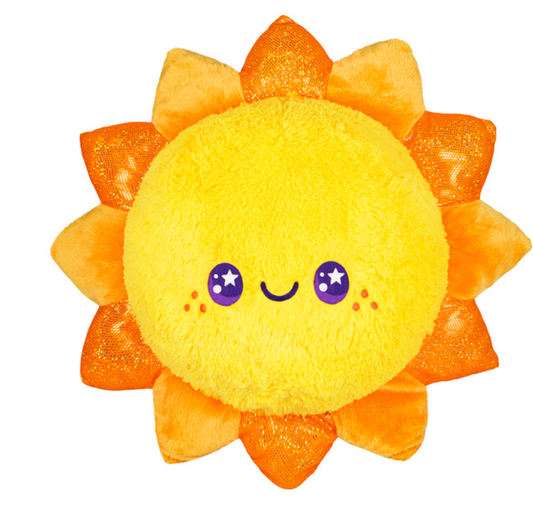 Squishable Celestial Sun plush toy with a yellow sun shape, orange rays, smiling face, and purple starry eyes.