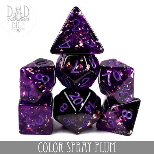 7-piece Color Spray Plum dice set made of purple resin with gold flakes for tabletop gaming.