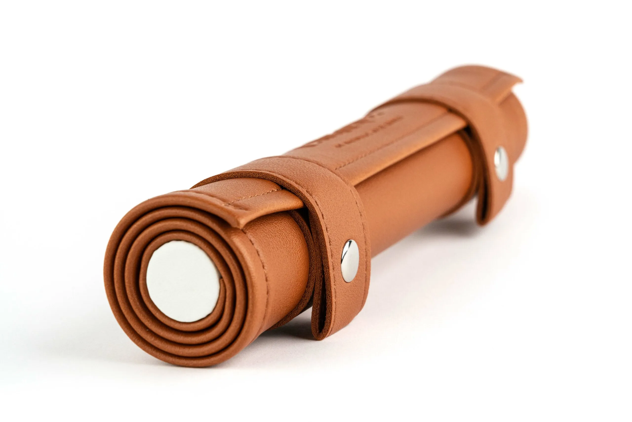 Tan leather Dice Scroll Rolling Mat and Carrying Case with snap closures.