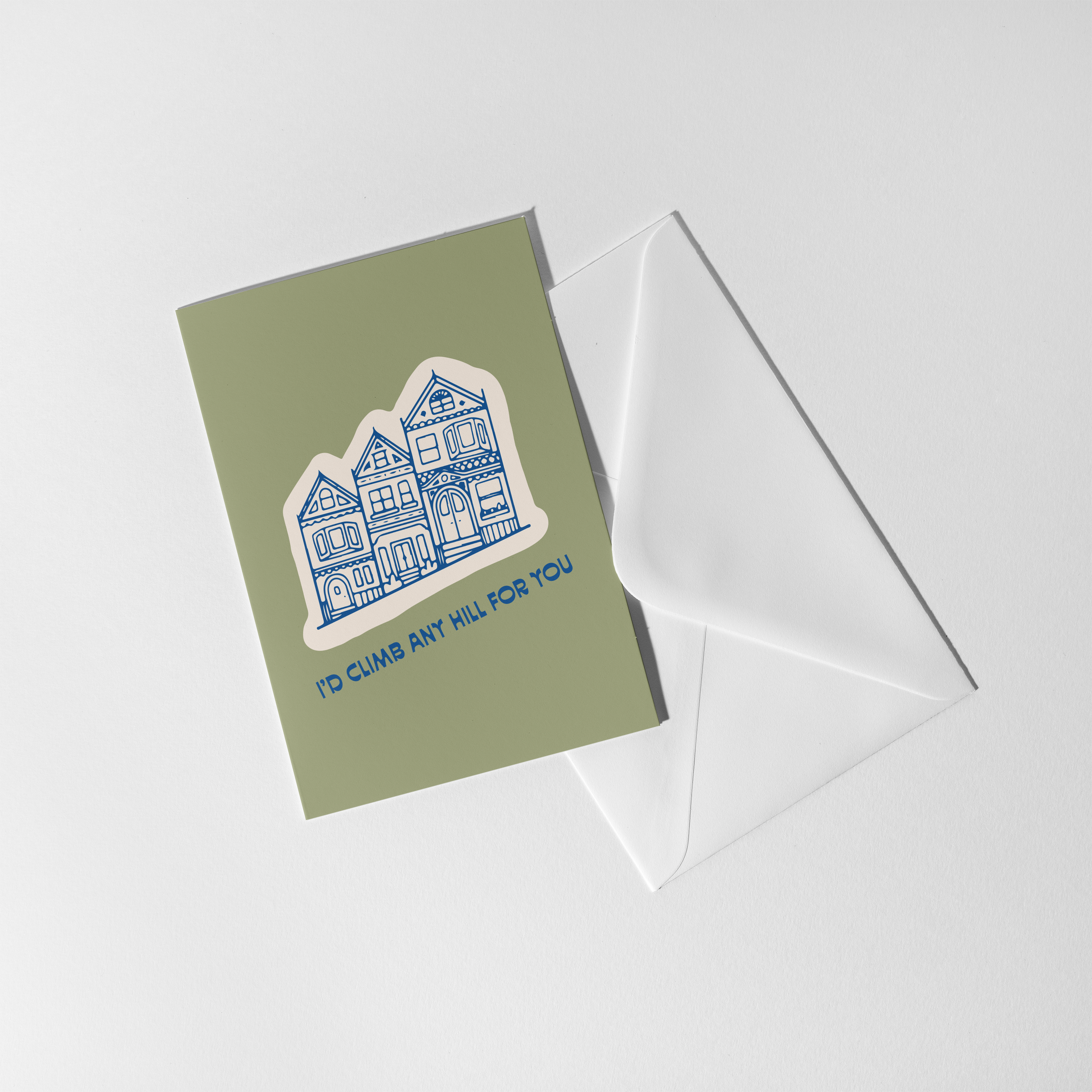 I’d Climb Any Hill For You greeting card featuring blue houses, designed by Aleisha Nelson.