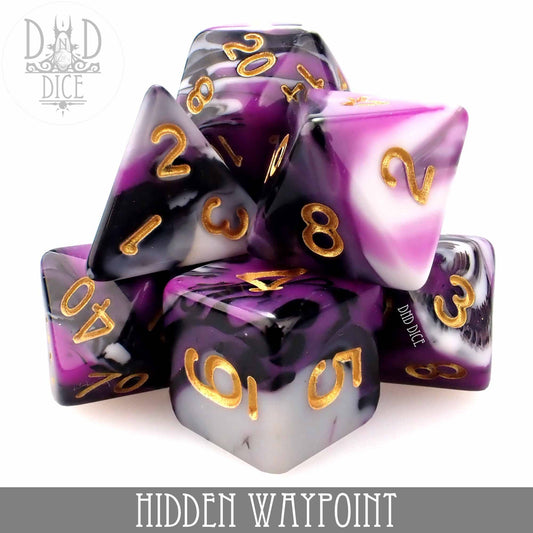 Purple, black, and white acrylic dice with gold numbers, stacked beneath text reading Hidden Waypoint.