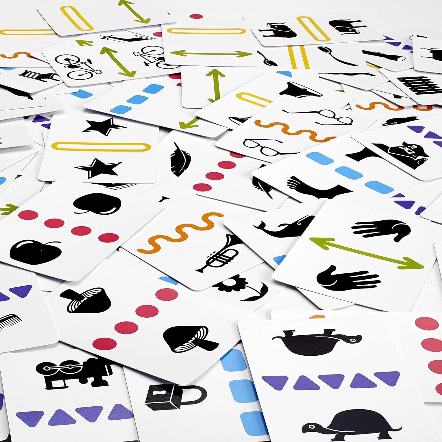 Anomia Kids game cards with colorful shapes and black icons of animals, stars, and hands.