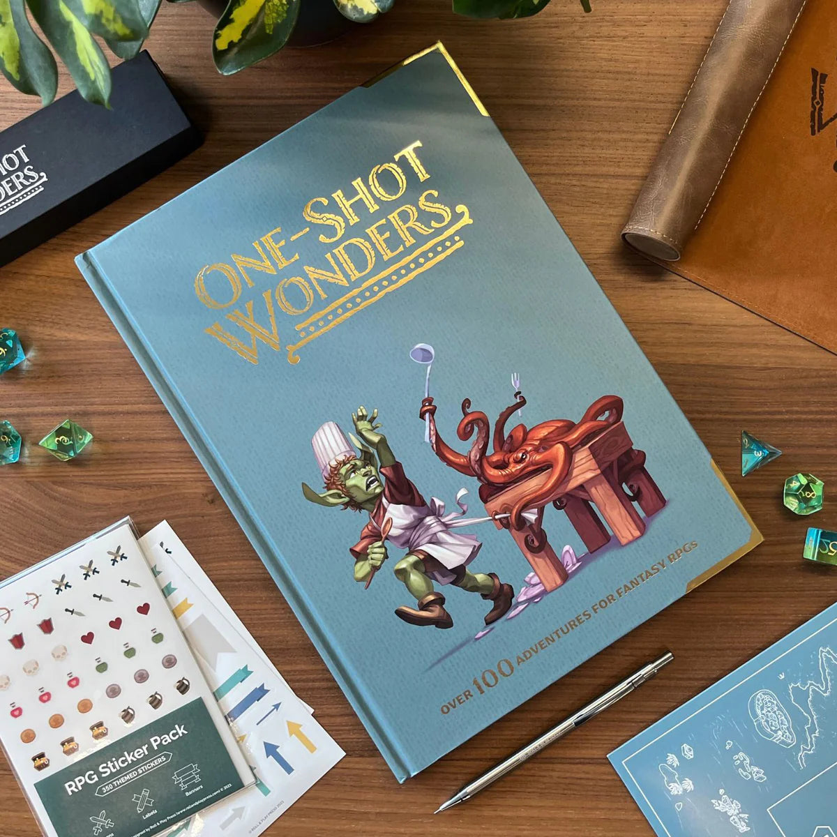 One-Shot Wonders product shown with RPG dice, map, and pen for DnD one-shot adventures.