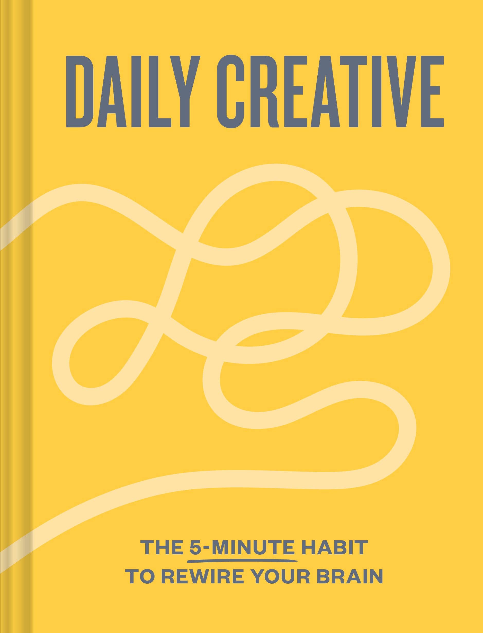Yellow book titled “Daily Creative” with daily exercises to boost creativity and rewire your brain.