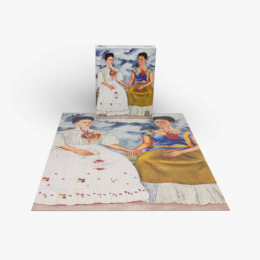 The Puzzles Frida Kahlo Two Fridas 1000-piece puzzle featuring The Two Fridas artwork on the box front.
