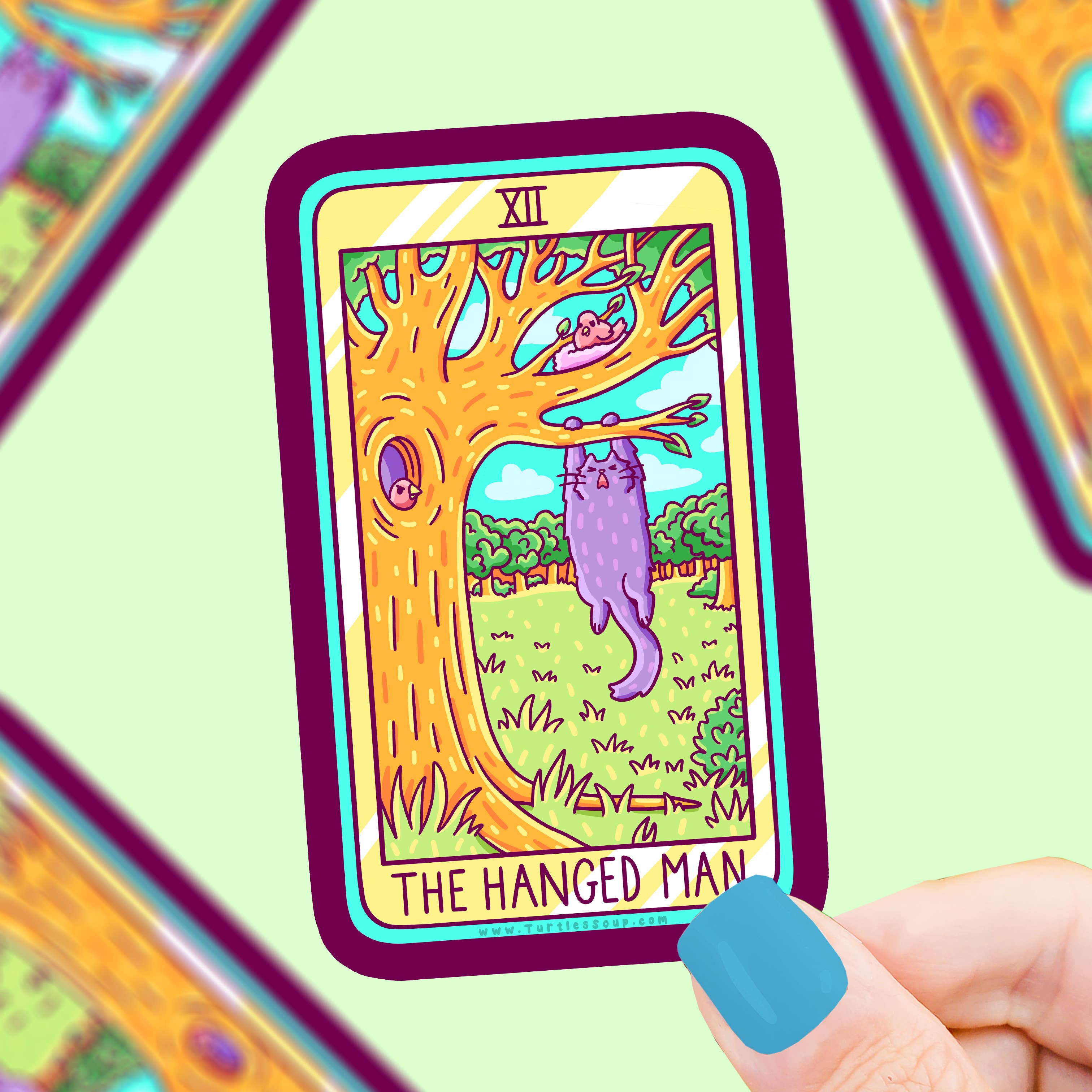 The Hanged Man Cat Major Arcana Tarot Card vinyl sticker featuring a purple cat hanging from a tree; waterproof.