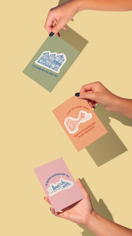 Id Climb Any Hill For You greeting card with city-inspired illustrations held by three hands.
