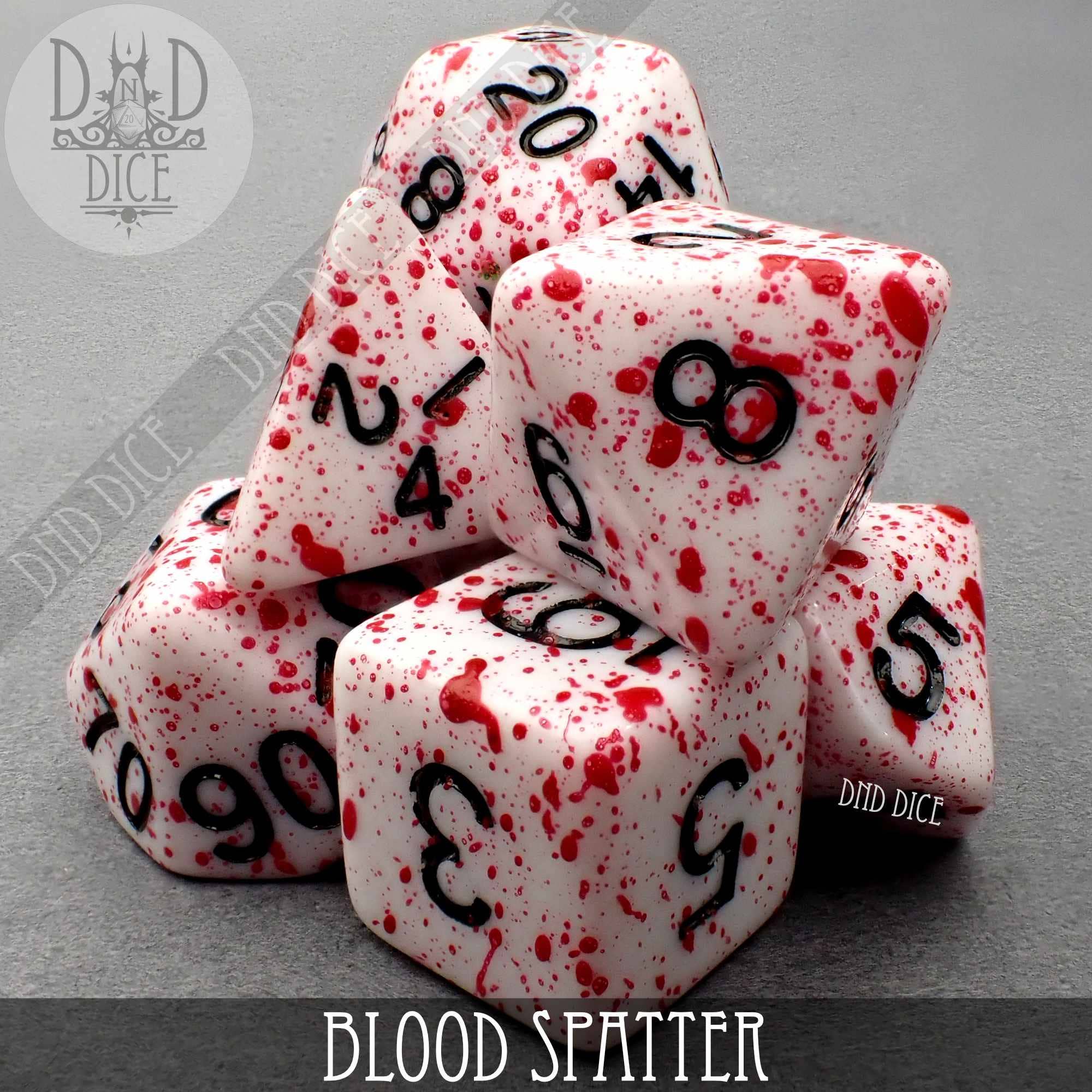 Blood Spatter hand-painted acrylic DND dice set with black numbers and red splatter pattern.