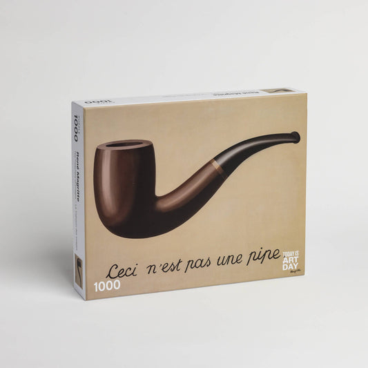 Puzzle box with René Magritte’s This is not a pipe artwork on the cover.