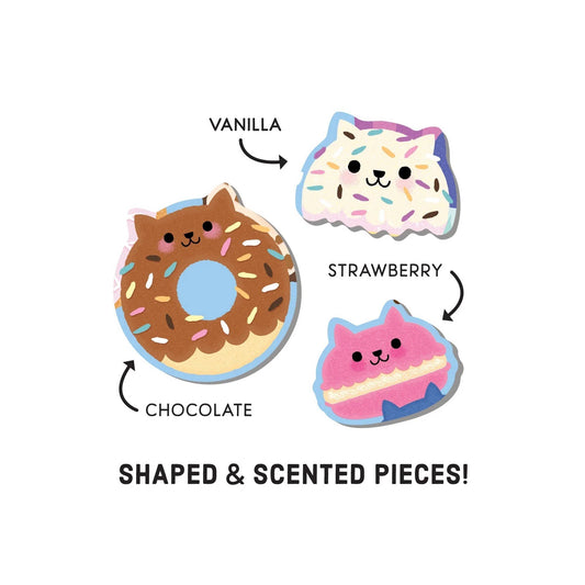 Cat Cafe 60-piece scratch & sniff puzzle featuring chocolate donut, vanilla cookie, and strawberry macaron scents.