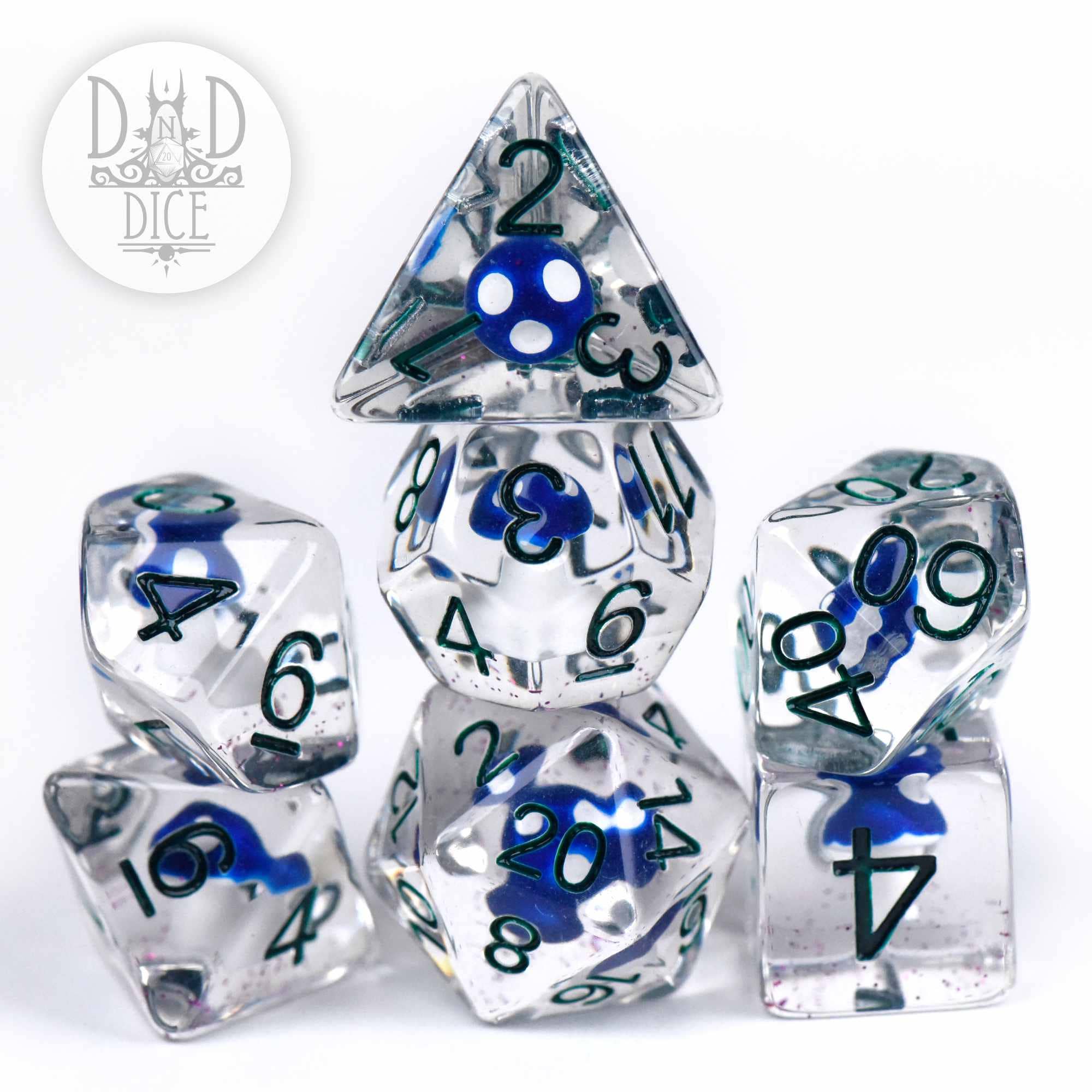 Fungal Spores 7-dice set of clear resin dice with blue shapes inside; DnD Dice logo in corner.