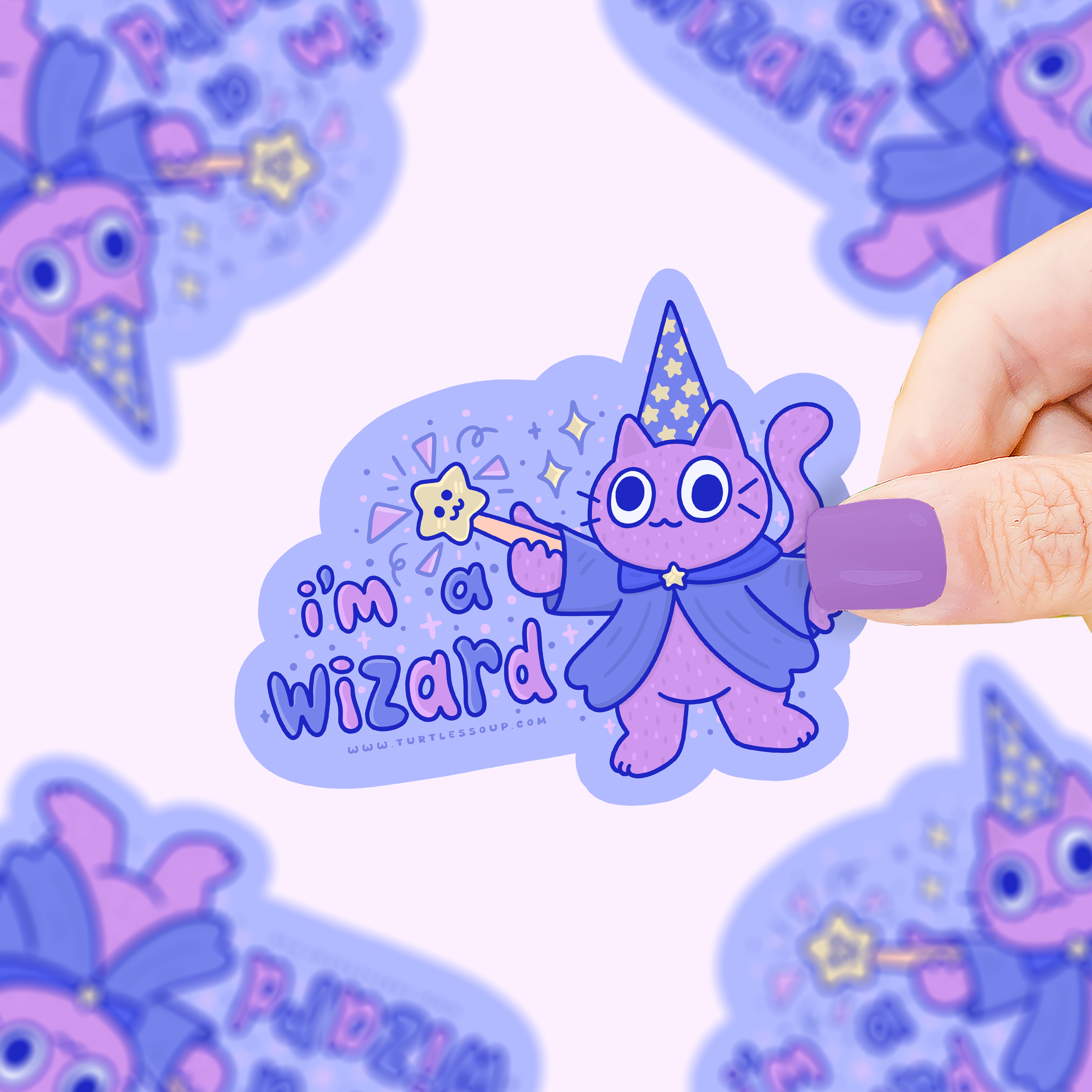 Im A Wizard sticker featuring a purple cat in wizard costume held in a hand.
