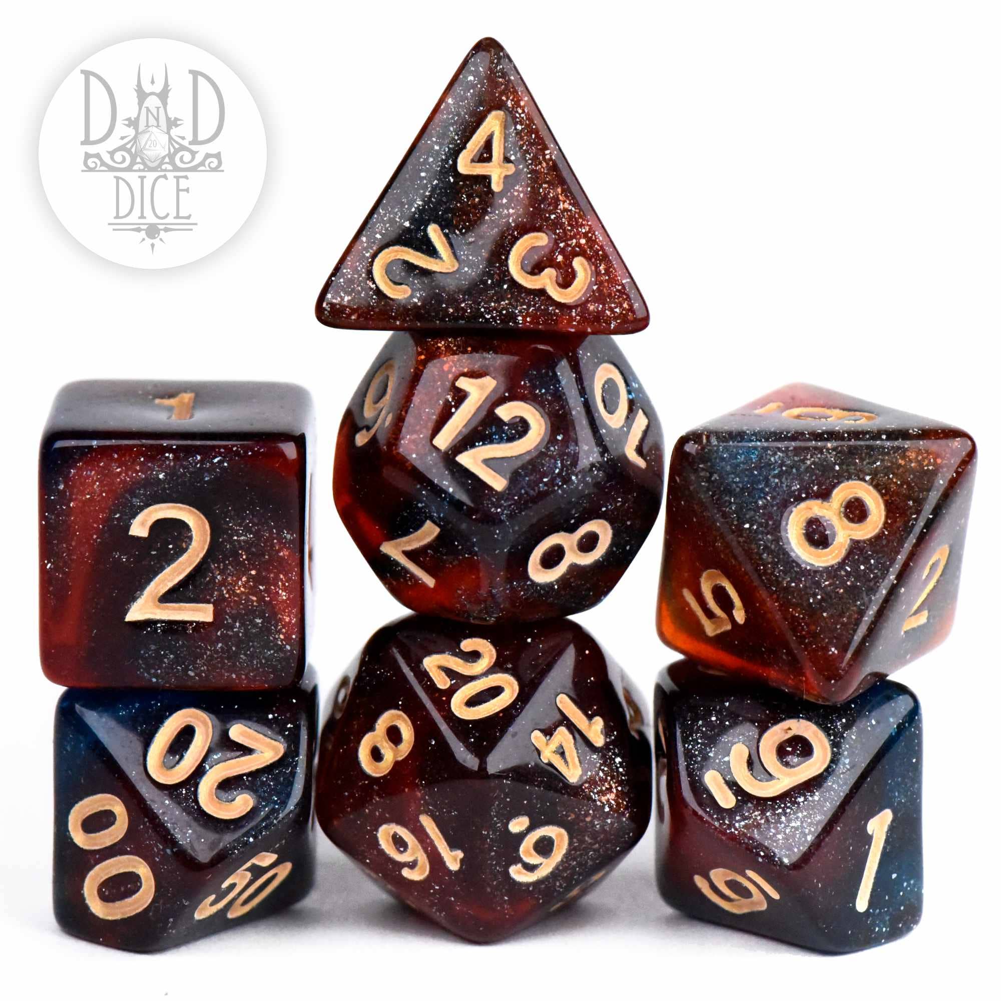 Elysium 7-piece acrylic dice set, glittery red and black with gold numbers.