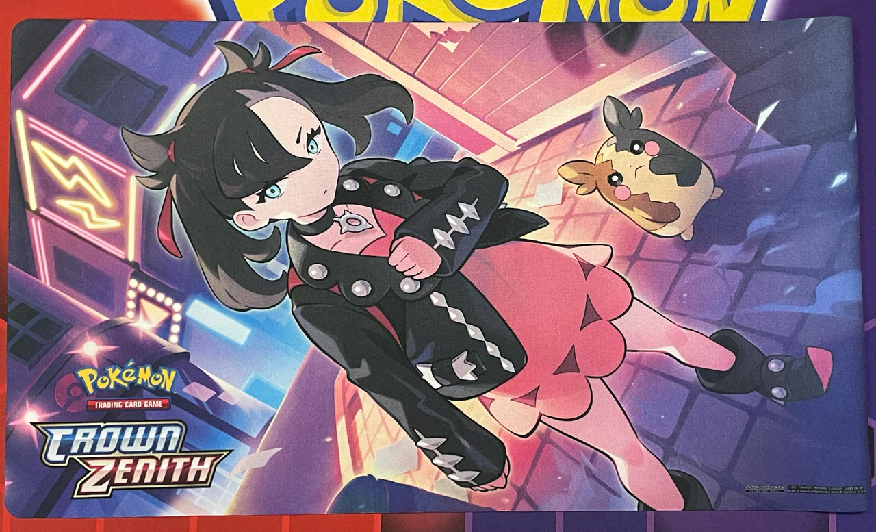Crown Zenith Playmat featuring Marnie in a black jacket and pink dress with Morpeko on a neon street.