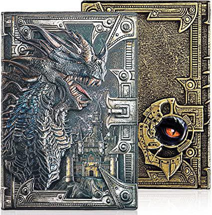 Two dragon leather notebooks: one with 3D dragon and castle design, one with gold pattern and dragon eye detail.
