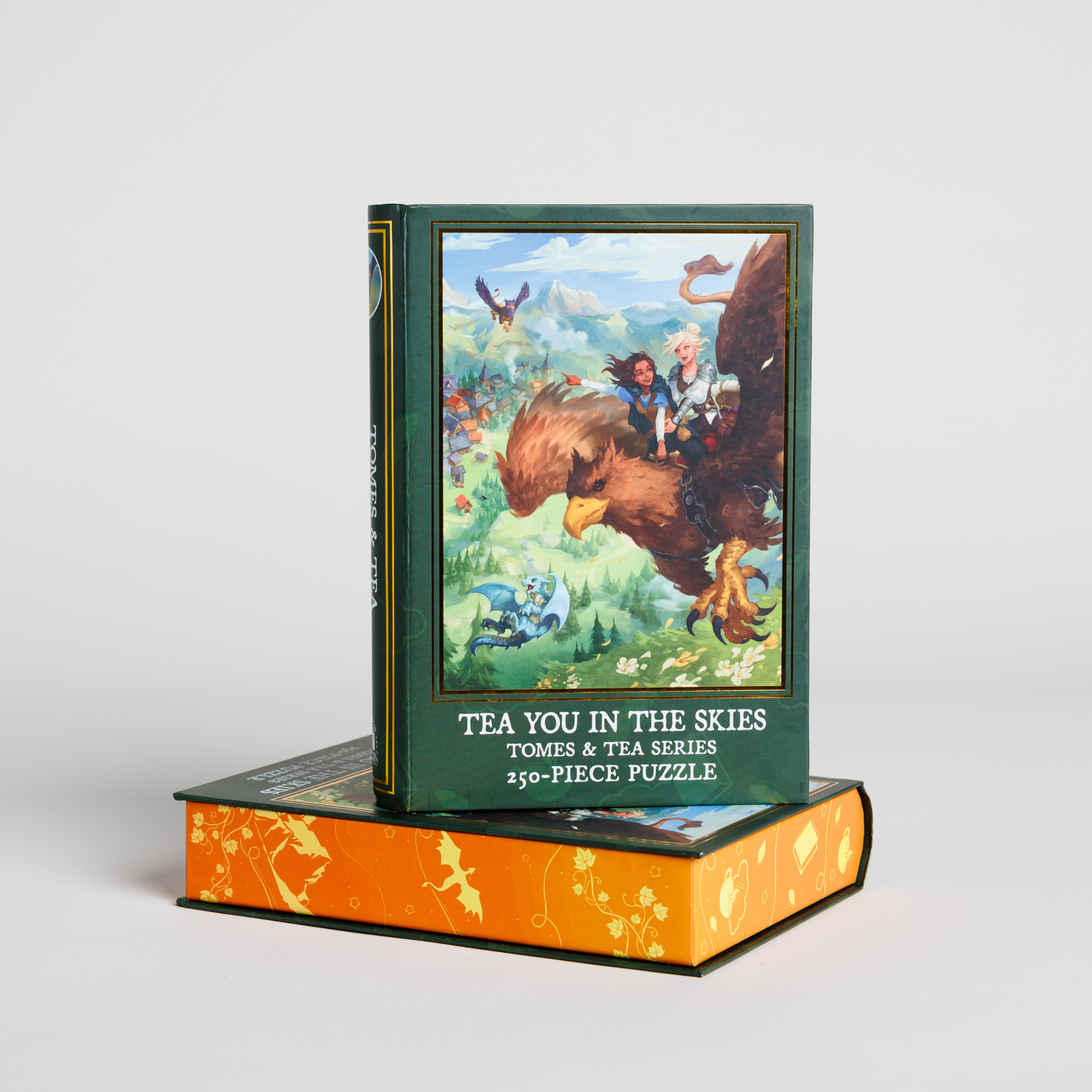 The Tea You in the Skies Keepsake Puzzle by Tomes & Tea, 250 pieces, features fantasy art of people riding a griffin.