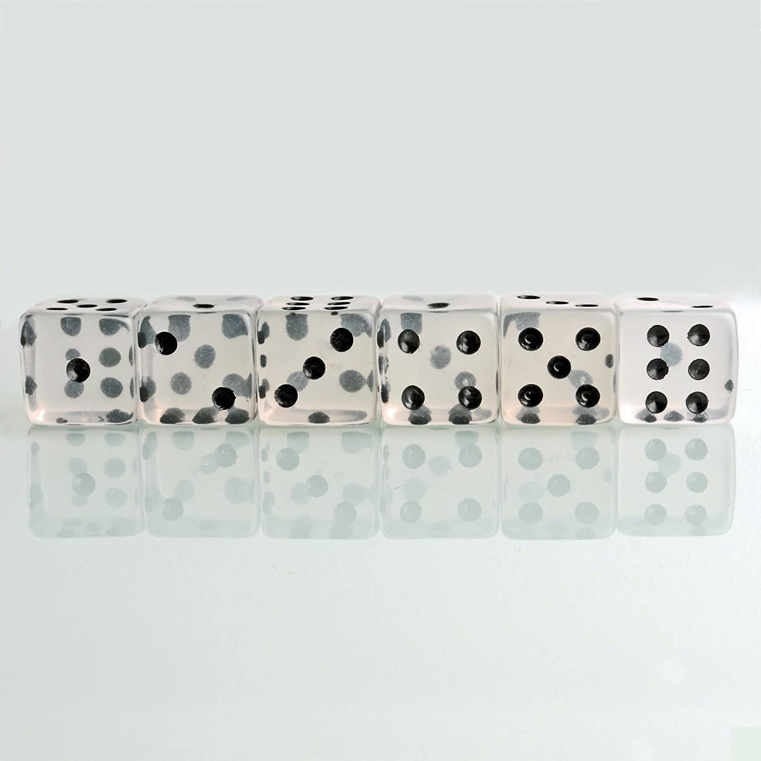 Set of six clear WE Games dice.