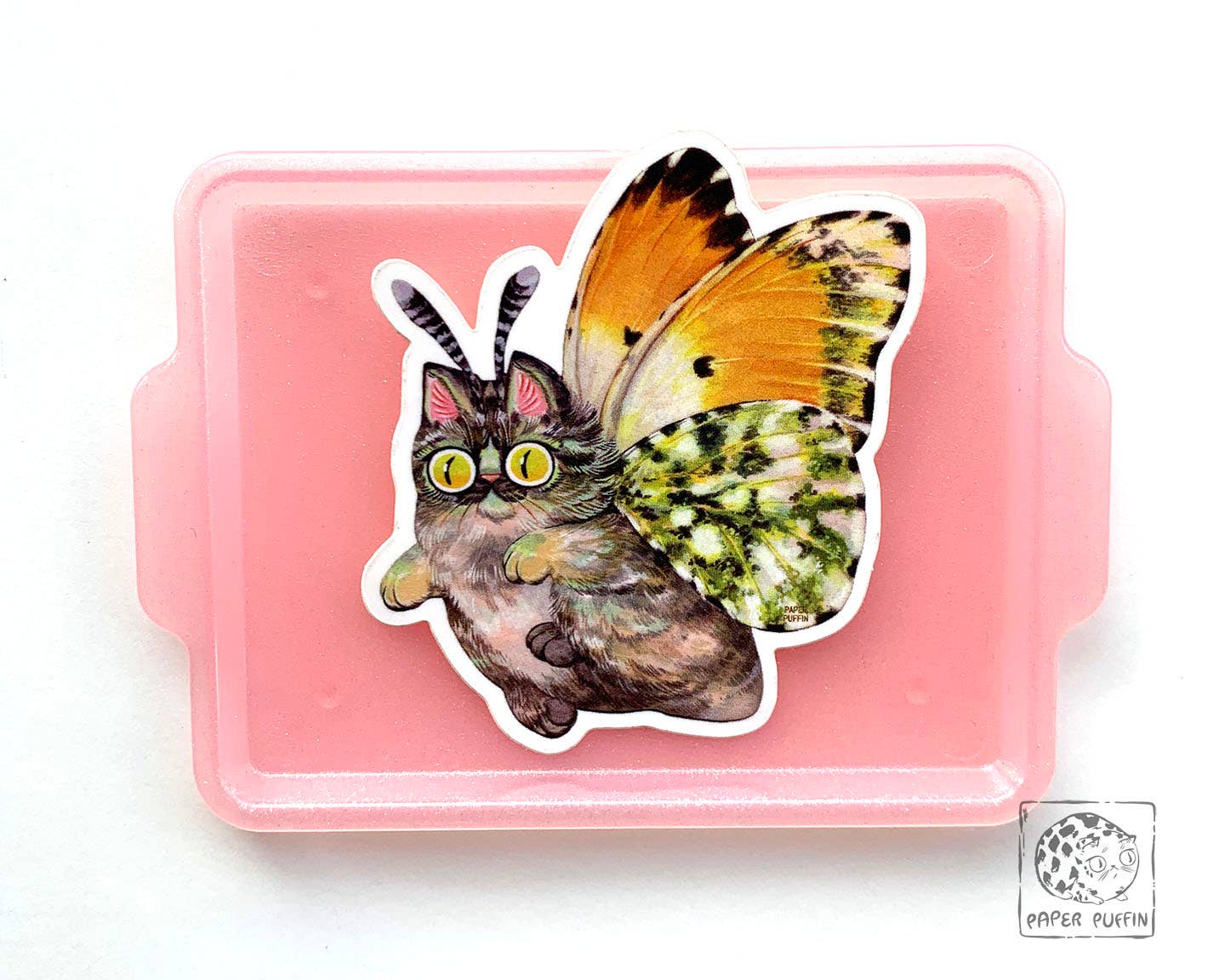 Moth Cat Tippy die-cut vinyl sticker featuring a fluffy cat with orange and green moth wings.