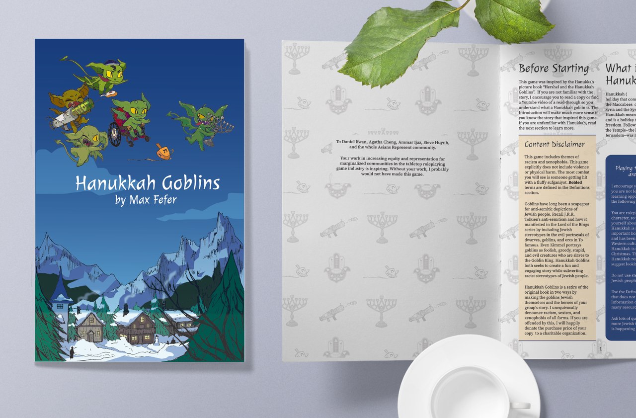 Hanukkah Goblins book displayed next to an open book, a leaf, and a white teacup.