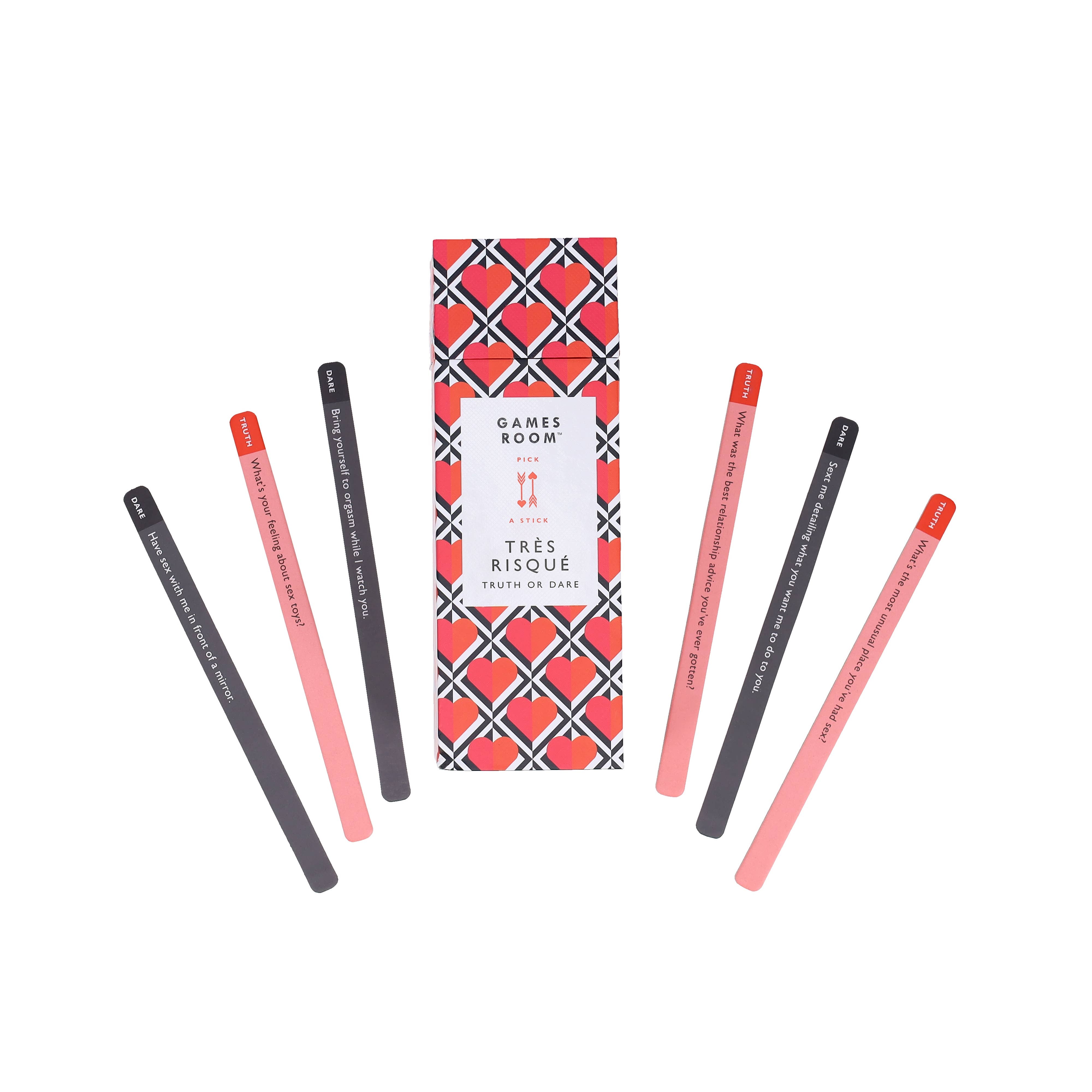 Tres Risque Truth or Dare box with seven colored sticks displayed in a semi-circle around it.