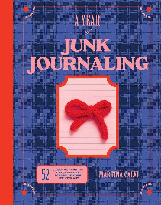 A Year of Junk Journaling scrapbook prompts on lined paper with red yarn bow.