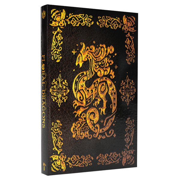 Floral Dragons Deluxe Edition black book with gold floral dragon designs on the cover.