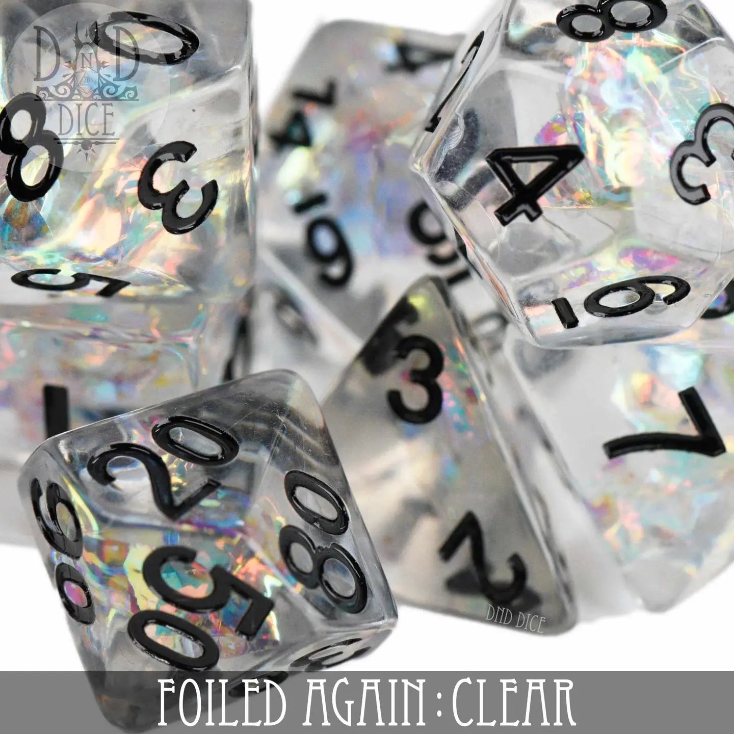 Foiled Again Clear Dice Set: 7 clear polyhedral dice with black numbers and iridescent foil.