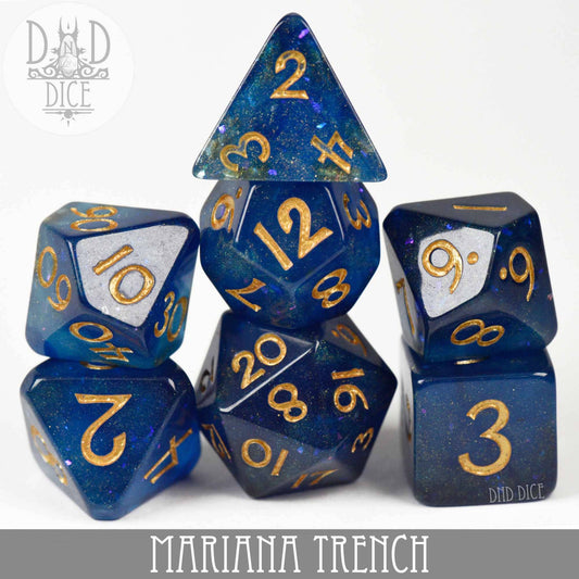 Mariana Trench set of seven blue and gold resin dice for tabletop gaming.