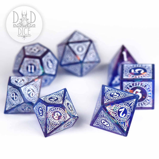 Set of seven blue Helheim Hold handmade resin dice with white numbers.