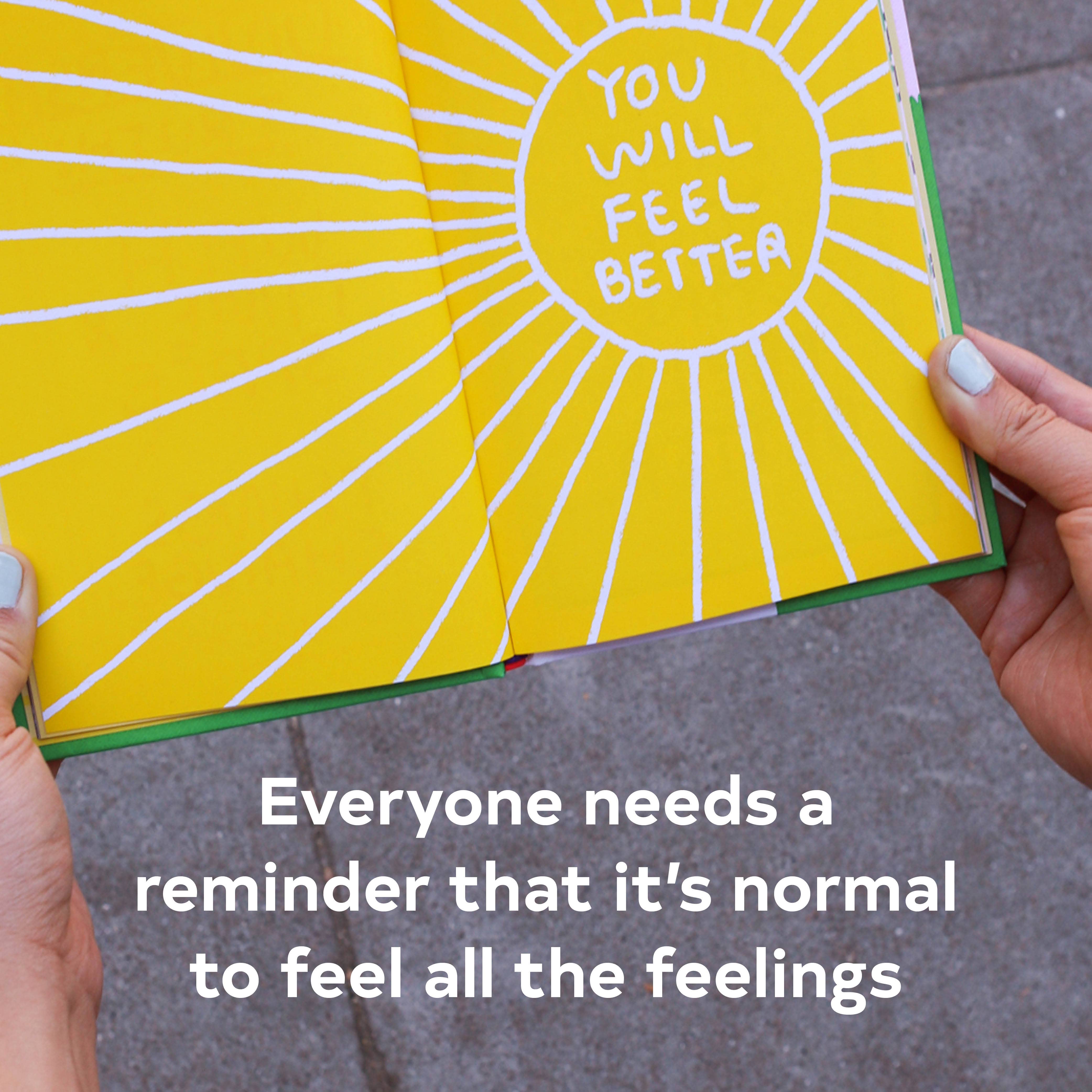 Hands hold a product labeled ‘Its OK to Feel Things Deeply’.