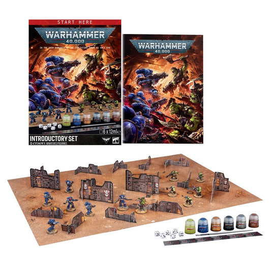 WARHAMMER 40000: INTRODUCTORY SET with rulebook, painted miniatures, dice, paint pots, and terrain on game board.