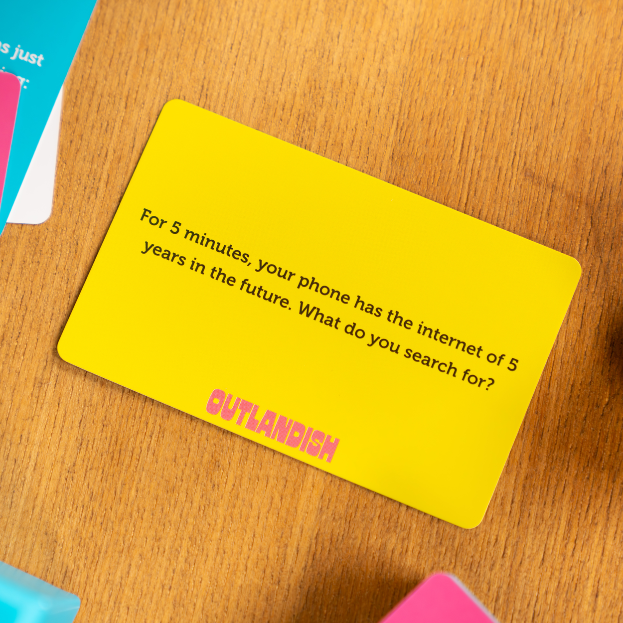 Yellow Outlandish card with the challenge: For 5 minutes, your phone has internet from 5 years in the future.