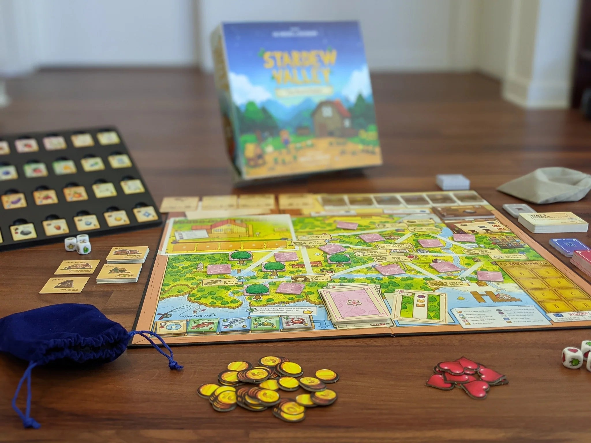 Stardew Valley The Board Game set up for community center play with cards, tokens, dice, and pieces.