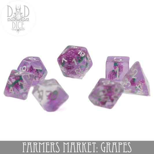 Translucent purple resin 7-dice set with grape designs, Farmers Market: Grape variant, for tabletop games.