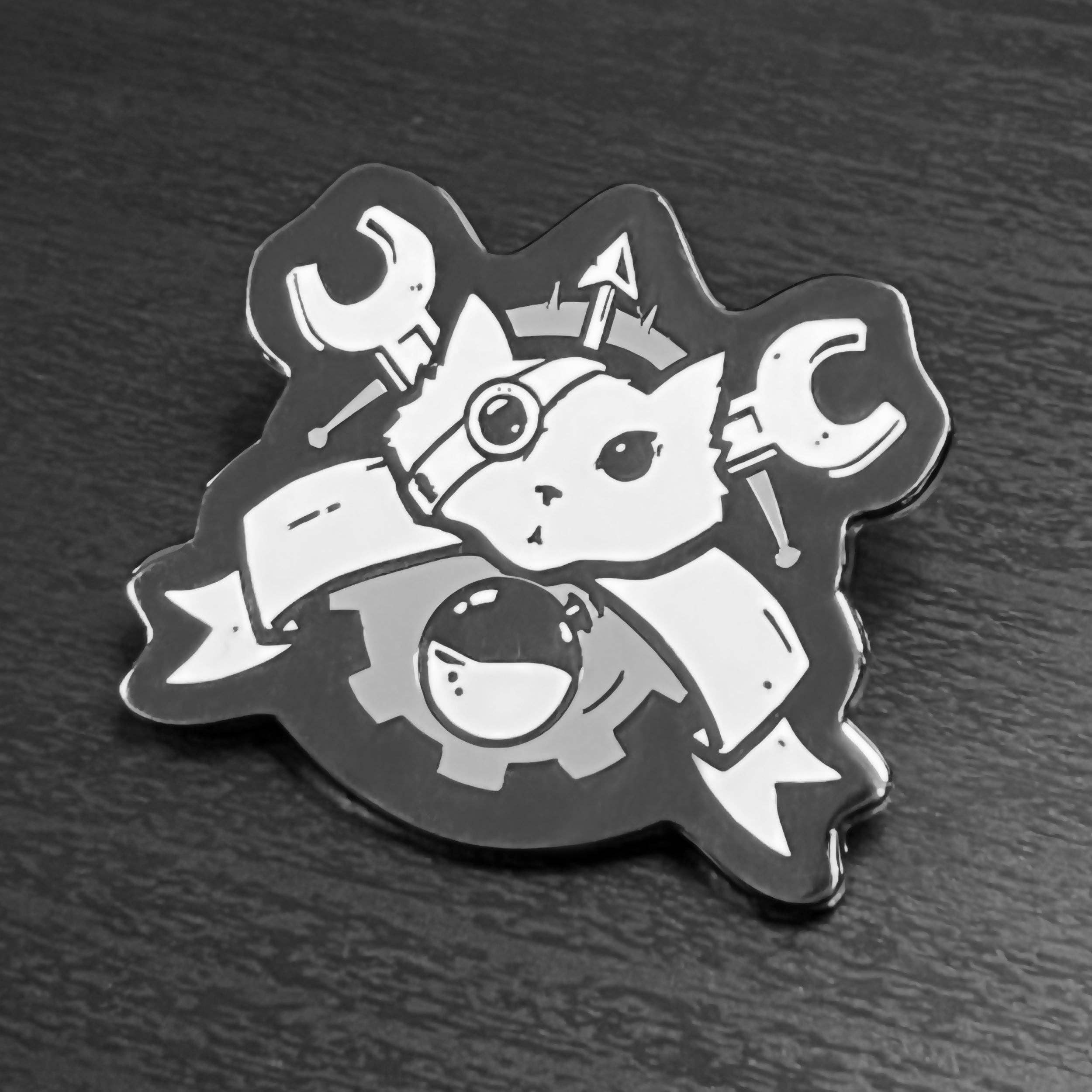 Artificer enamel pin featuring cat with headlamp, wrenches, gear, ribbon; black nickel plated.