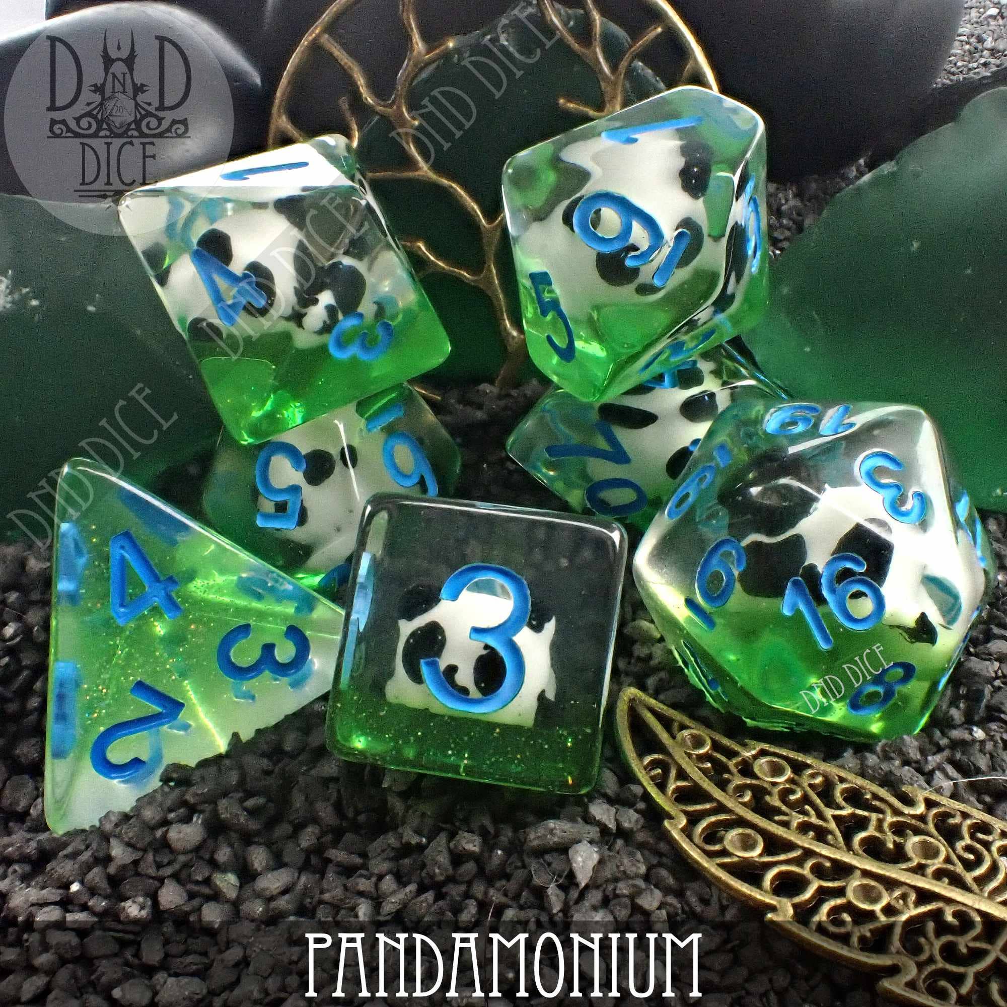 Pandamonium dice in green and clear resin with blue numbers and panda faces.