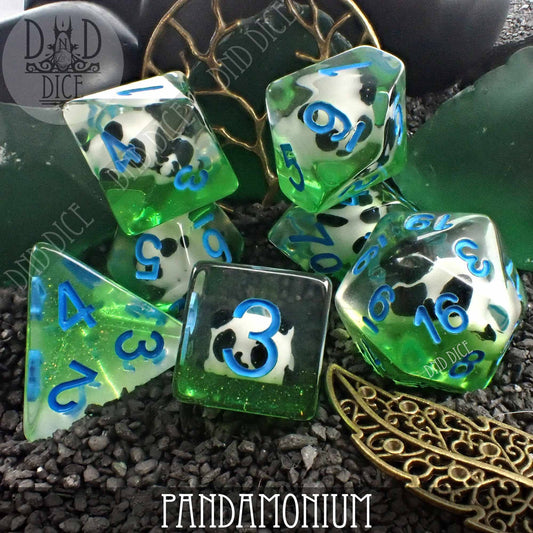 Pandamonium dice in green and clear resin with blue numbers and panda faces.