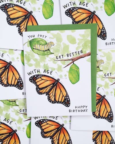 Better With Age Monarch Butterfly Birthday Card featuring caterpillars, chrysalises, and hand lettered greeting.