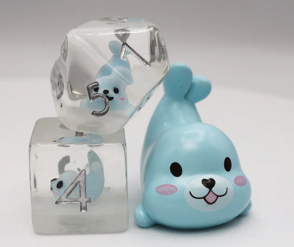 Blue Seal RPG Dice Set with two clear polyhedral dice, each containing a blue seal figurine inside.