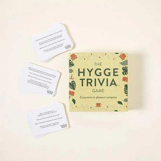The Hygge Trivia Game with cards featuring questions on Scandinavian hygge and random facts.
