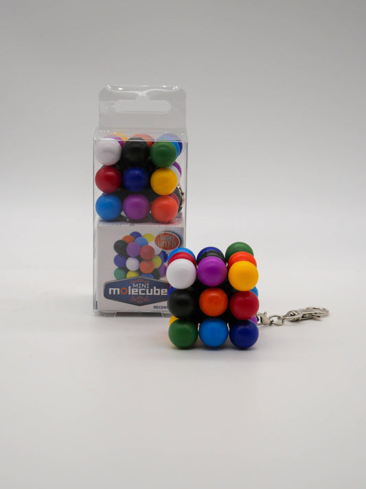 Mefferts Keychain Mini Molecube, a colorful spherical puzzle, with packaging in the background.