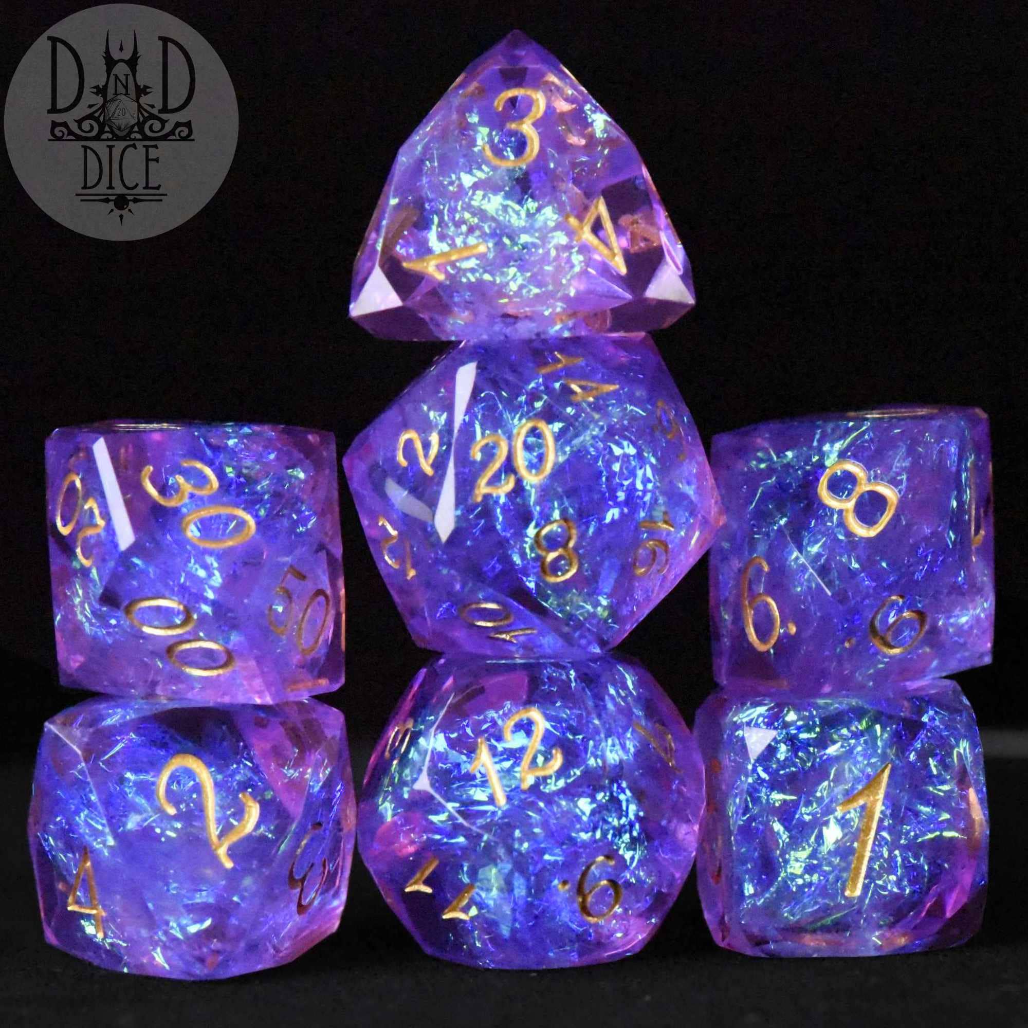 Set of six Crown Jewels Imperial dice in purple resin with gold numbers.